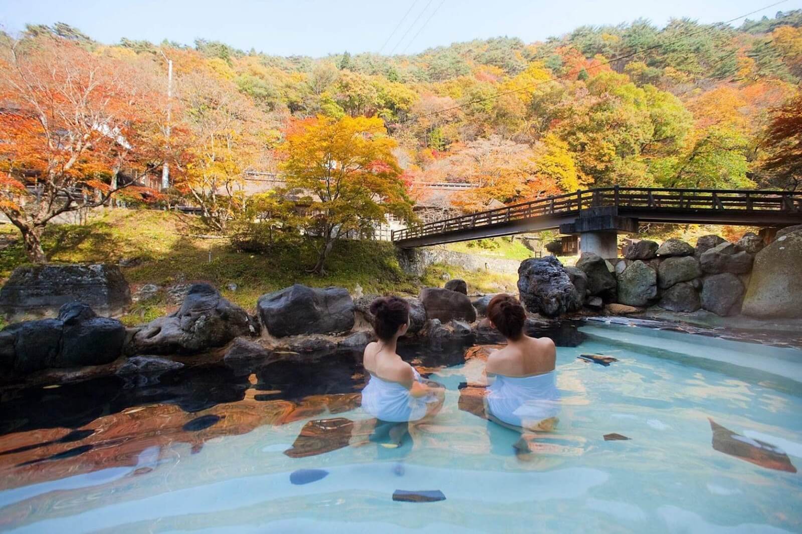 A group of people in a hot springDescription automatically generated